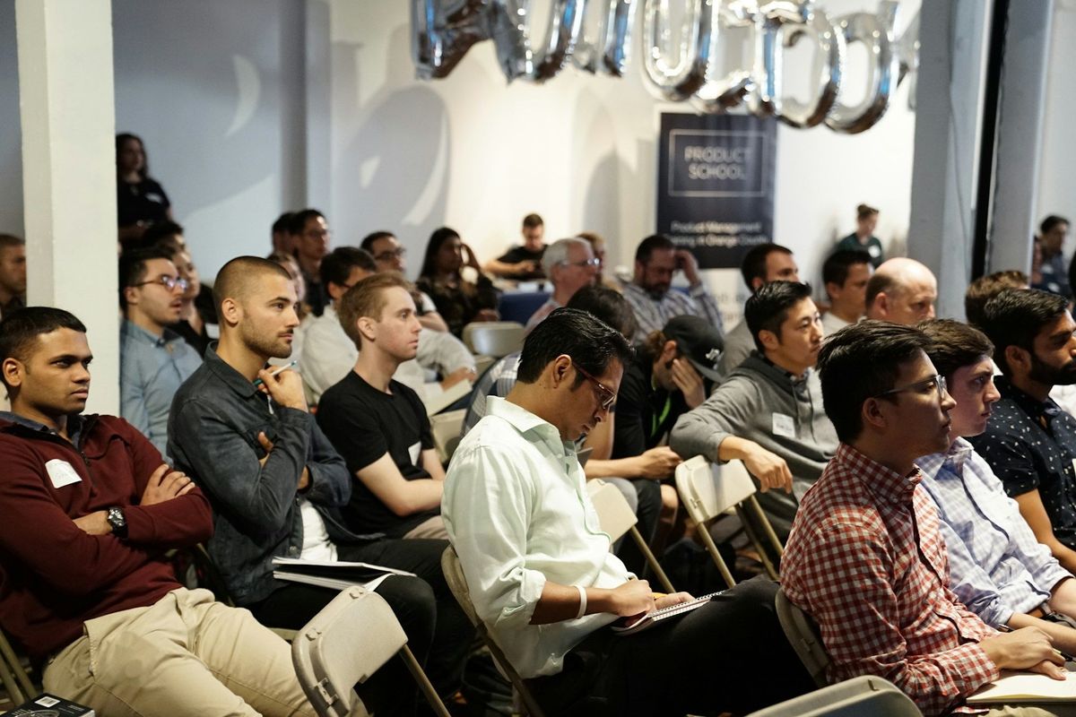 a conference audience who look bored